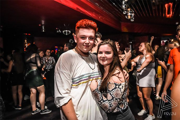Image may contain: Bar Counter, Accessory, Sunglasses, Accessories, Footwear, Shoe, Apparel, Clothing, Pub, Disco, Night Life, Party, Night Club, Club, Person, Human