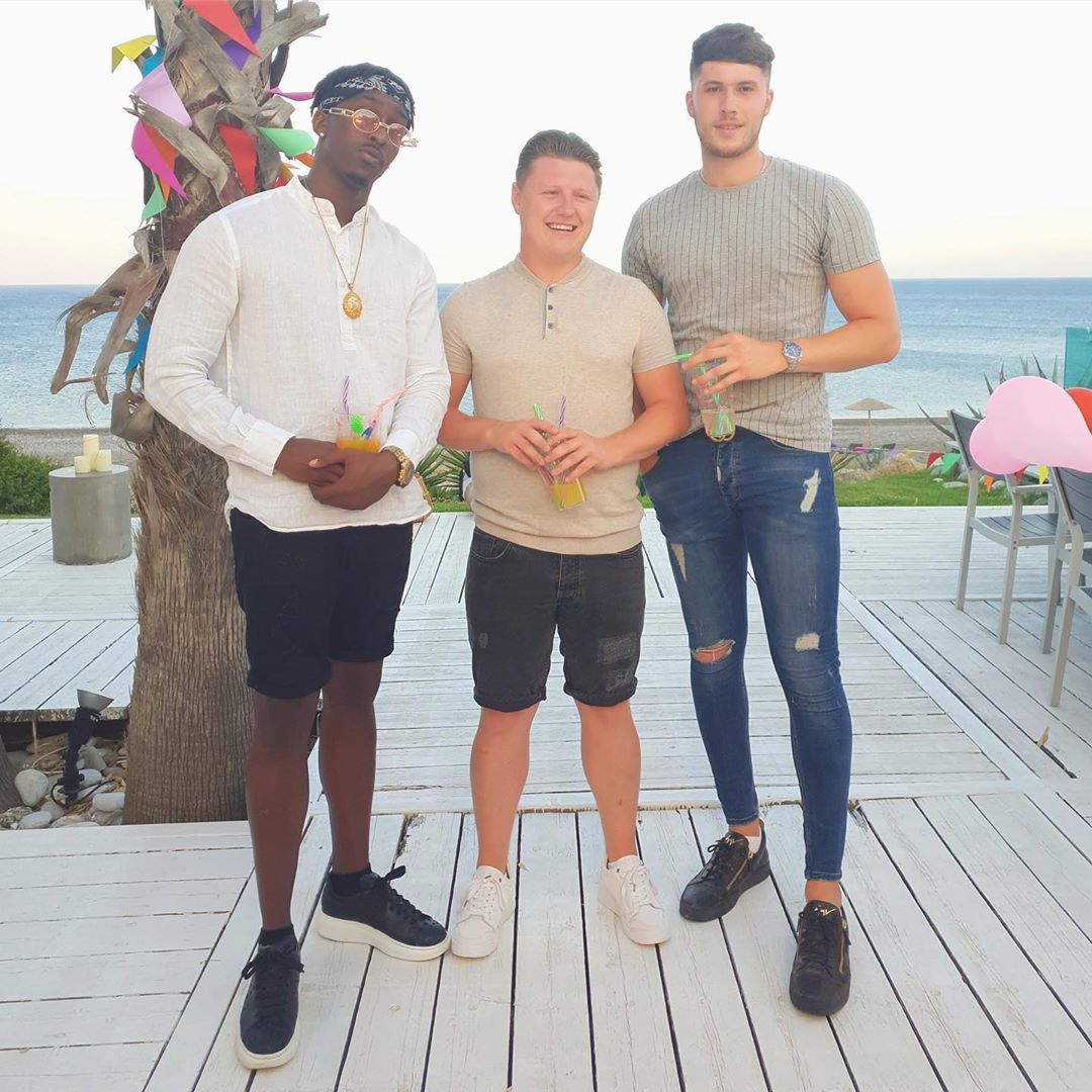Image may contain: Heartbreak Holiday, Jordy, Dean, Luke, Love Island, BBC, cast, contestants, watch, online, Instagram, age, lineup, Greece, Mykonos, Boardwalk, Bridge, Building, Wood, Pants, Shorts, Shoe, Footwear, Person, Human, Apparel, Clothing