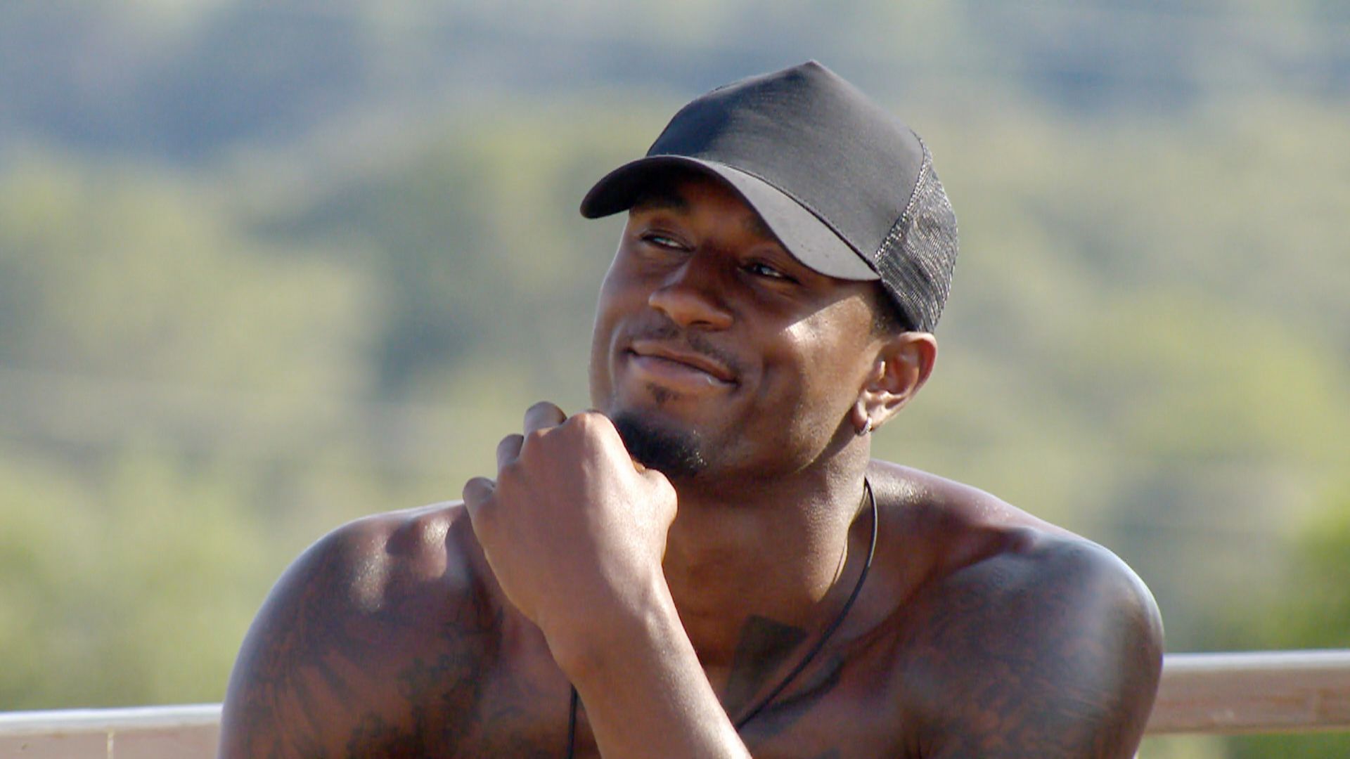 Image may contain: Ovie left Love Island villa, Ovie Soko, Love Island, Ovie, basketball, secretly, leave, producers, gossip, Cap, Finger, Hat, Apparel, Clothing, Person, Human