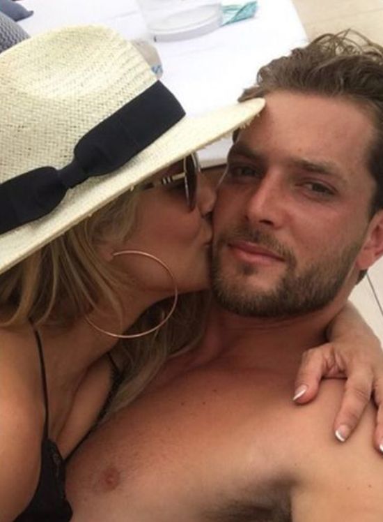 Image may contain: Caroline Flack's boyfriend, Lewis Burton, tennis, player, model, Caroline Flack, boyfriend, new, latest, news, gossip, ex, Instagram, age, holiday, pictures, Insta, story, official, Cap, Hat, Baseball Cap, Kiss, Kissing, Apparel, Clothing, Person, Face, Human