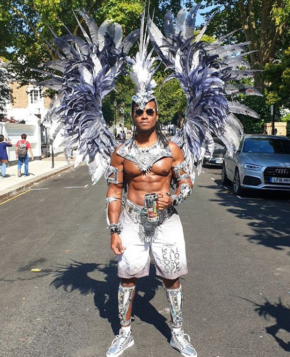 Image may contain: Carnival, Crowd, Transportation, Vehicle, Automobile, Car, Accessories, Accessory, Sunglasses, Costume, Human, Person, Skin