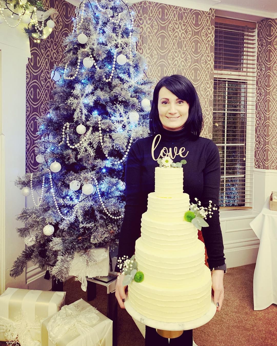 Image may contain: Great British Bake Off 2019, Michelle Evans-Fecci, Michelle, cast, contestants, lineup, Instagram, GBBO, Bake Off, 2019, start date, Channel 4, Christmas Tree, Ornament, Wedding Cake, Tree, Plant, Cake, Food, Dessert, Human, Person