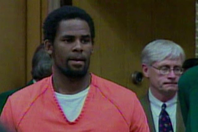 Image may contain: Surviving R Kelly, Netflix, R Kelly, documentary, true crime, US, UK, release date, about, allegations, interviews, court, trial, news, updates, doc, series, how to watch, Crowd, Court, Room, Indoors, Face, Person, Human, Accessories, Tie, Accessory