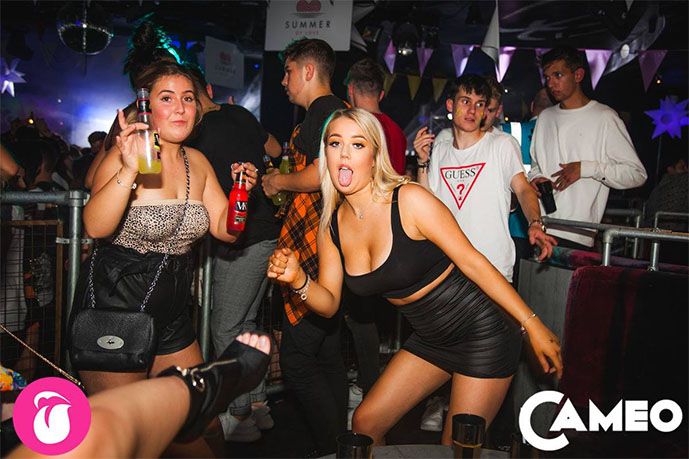 Image may contain: Drink, Beverage, Night Life, Clothing, Apparel, Bar Counter, Pub, Party, Night Club, Club, Person, Human