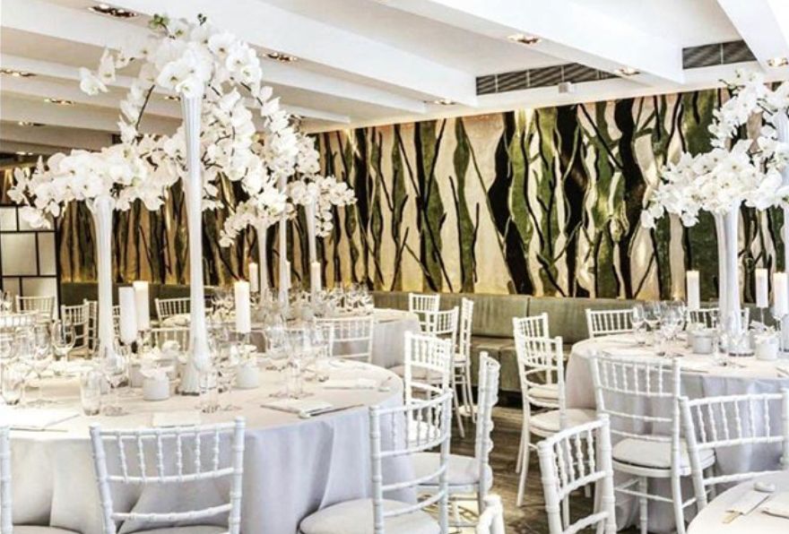 Image may contain: Hall, Dining Room, Interior Design, Home Decor, Waiting Room, Reception, Reception Room, Tablecloth, Ballroom, Table, Dining Table, Room, Chair, Indoors, Furniture