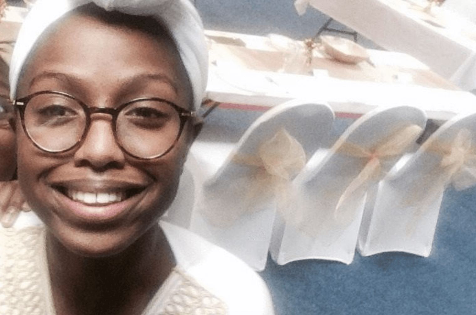 Image may contain: Joy Morgan, case, news, Hat, Photography, Portrait, Photo, Female, Smile, Apparel, Clothing, Face, Human, Person, Glasses, Accessories, Accessory