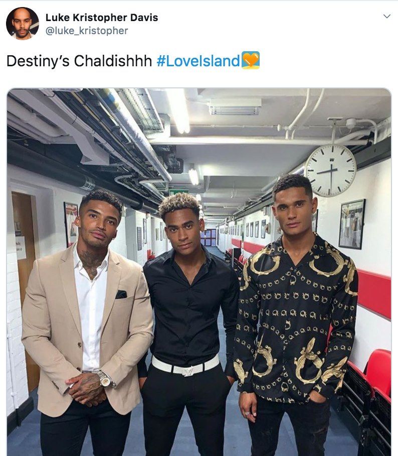 Image may contain: Love Island reunion memes, Love Island, reunion, meme, reaction, tweet, funny, last night, Michael, Danny, Jordan, Destiny's Child, Chaldish, Jeans, Denim, Suit, Overcoat, Coat, Pants, Building, Tower, Architecture, Clock Tower, Long Sleeve, Sleeve, Person, Human, Apparel, Clothing