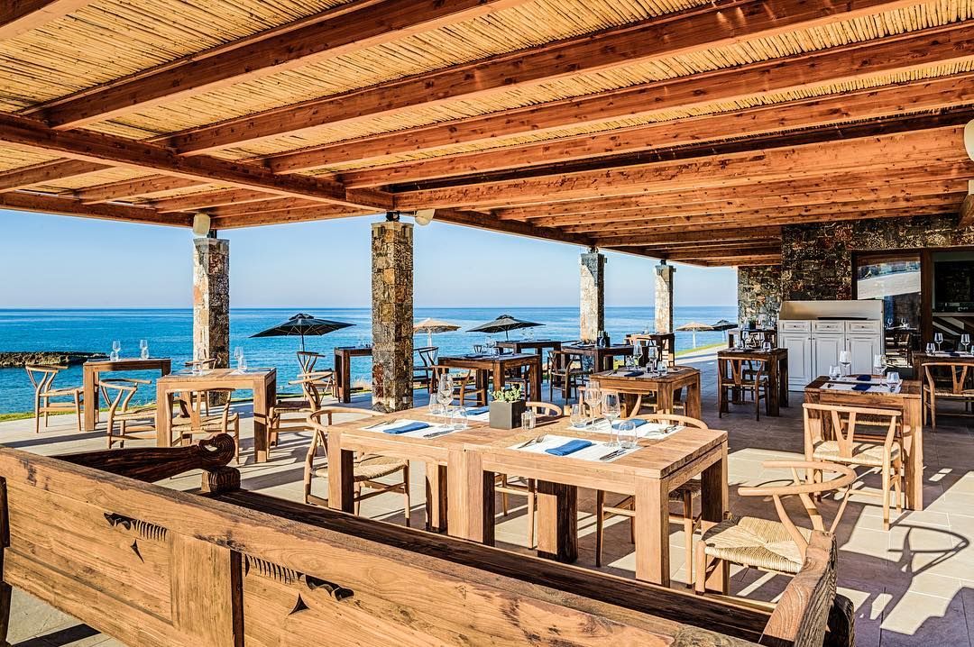 Image may contain: Abaton Island resort, Celebs Go Dating, final, Abaton Island Resort & Spa, Crete, Greece, Abaton, hotel, Island, bar, cost, Lumber, Building, Chair, Restaurant, Cafeteria, Hardwood, Tabletop, Furniture, Plywood, Wood