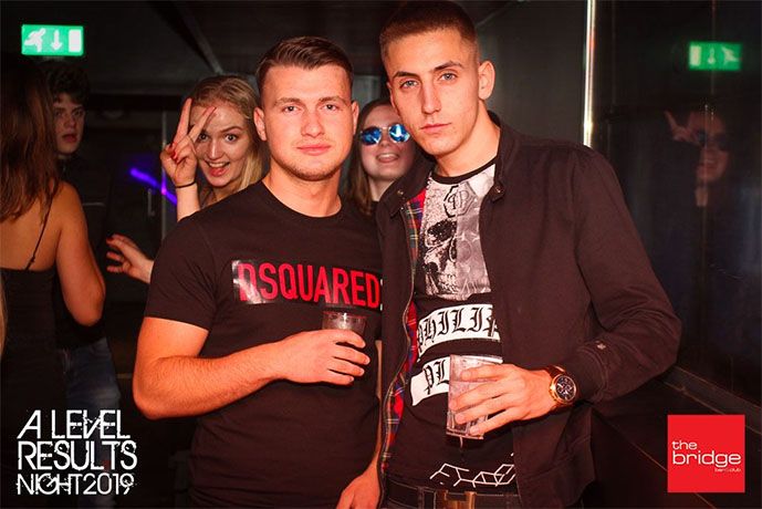 Image may contain: Night Life, Beverage, Drink, Night Club, Sunglasses, Accessories, Accessory, Party, Pub, Bar Counter, Clothing, Apparel, Club, Human, Person