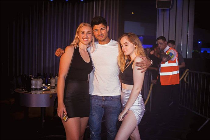 Image may contain: Night Life, Party, Bar Counter, Pub, Female, Pants, Night Club, Club, Clothing, Apparel, Human, Person