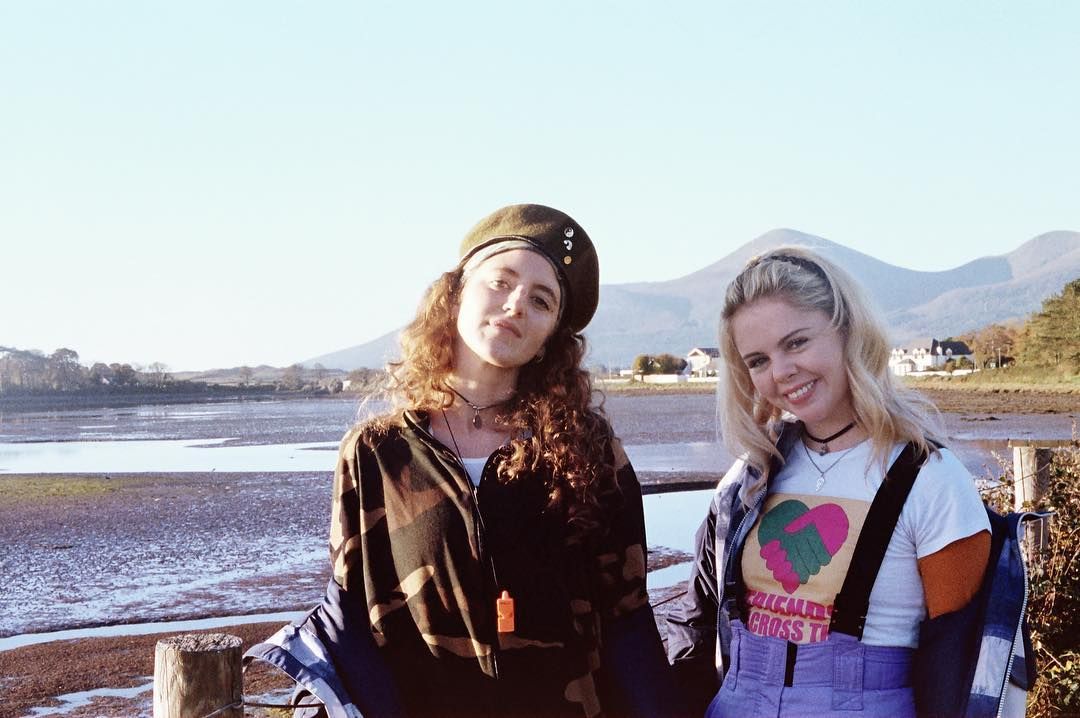 Image may contain: Derry Girls cast, Derry Girls, Saoirse-Monica Jackson, Erin, age, how old, Instagram, from, Netflix, Channel 4, season 2, season 3, Louisa Harland, Orla, Photography, Photo, Long Sleeve, Water, Outdoors, Robe, Evening Dress, Gown, Fashion, Sleeve, People, Smile, Pants, Blonde, Kid, Girl, Woman, Teen, Child, Face, Dress, Female, Apparel, Clothing, Human, Person