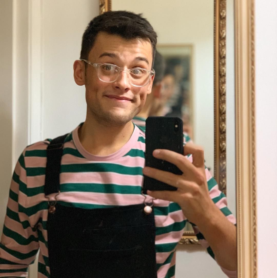 Image may contain: Great British Bake Off 2019, Michael Chakraverty, Michael, cast, contestants, lineup, Instagram, GBBO, Bake Off, 2019, start date, Channel 4, Portrait, Photo, Photography, Interior Design, Indoors, Face, Phone, Electronics, Cell Phone, Mobile Phone, Glasses, Accessory, Accessories, Person, Human