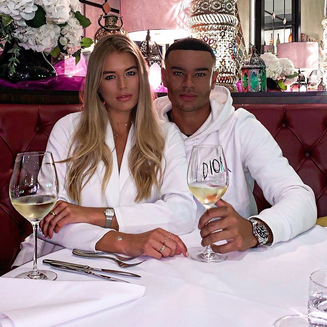 Image may contain: Pub, Bar Counter, Flower Bouquet, Sitting, Wine, Wine Glass, Flower Arrangement, Alcohol, Blossom, Flower, Beverage, Drink, Plant, Goblet, Dating, Person, Human, Glass