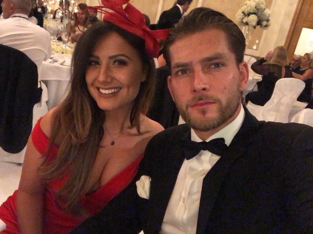 Image may contain: Caroline Flack's boyfriend, Lewis Burton, tennis, player, model, Caroline Flack, boyfriend, new, latest, news, gossip, ex, Instagram, age, Lauren Rose, girlfriend, Room, Premiere, Interior Design, Indoors, Fashion, Hat, Face, Suit, Apparel, Coat, Clothing, Overcoat, Person, Human, Tie, Accessories, Accessory