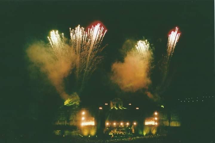 Image may contain: Smoke, Light, Flare, Crowd, Lighting, Night, Fireworks, Outdoors, Nature