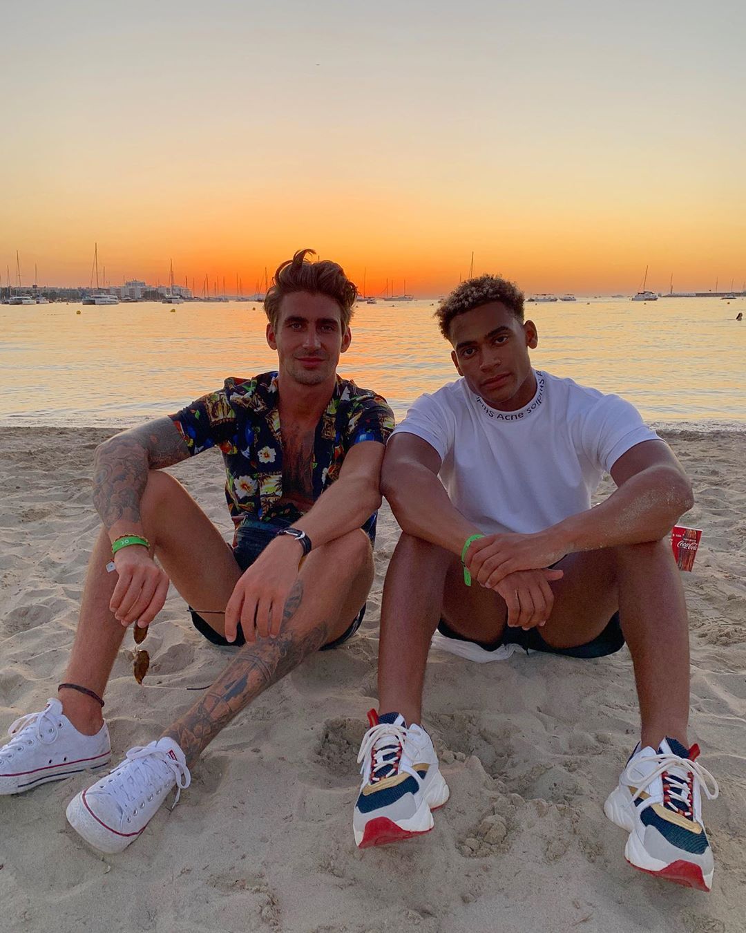 Image may contain: Molly-Mae and Tommy Ibiza, Love Island, Molly-Mae, Tommy, Ibiza, trip, group, holiday, Ocean beach, banned, invited, fake, Islanders, birthday, party, Chris Taylor, Jordan Hames, Sneaker, Running Shoe, Human, Person, Footwear, Shoe, Clothing, Apparel
