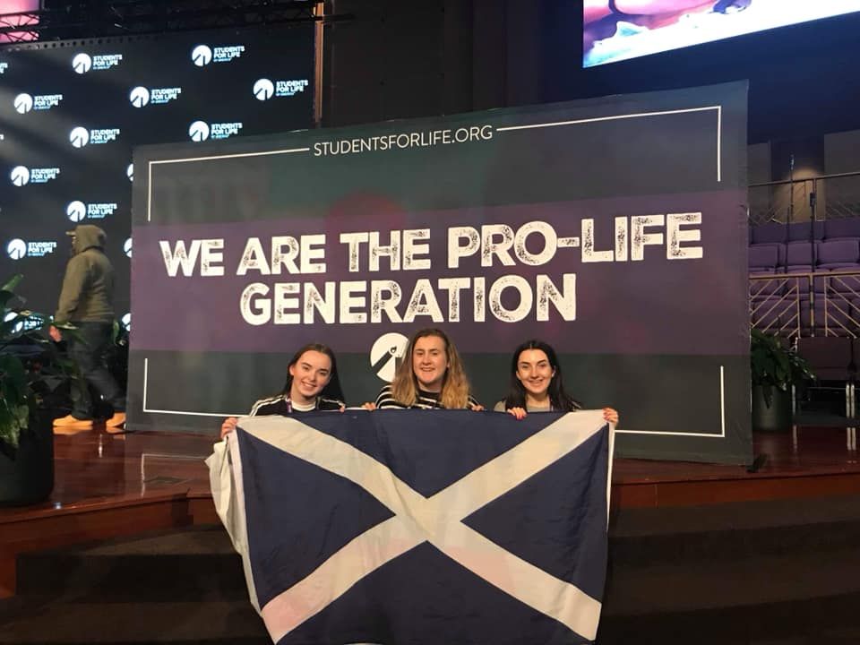 Image may contain: Text, Electronics, Screen, Crowd, Scoreboard, Symbol, Flag, Human, Person