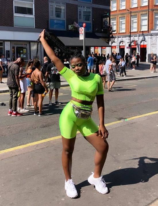 Image may contain: Town, Building, City, Street, Pedestrian, Urban, Text, Label, Shoe, Footwear, Road, Marathon, Shorts, Apparel, Clothing, Sports, Running, Sport, Human, Person