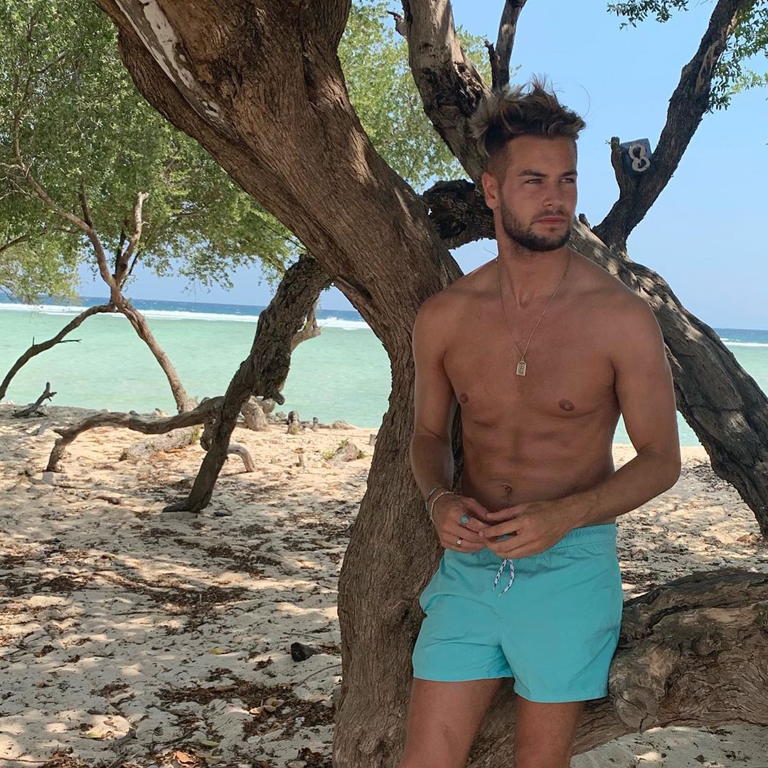 Image may contain: Love Island, gossip, news, latest, rumours, Chris Hughes, Bali, Instagram, Tree, Plant, Skin, Wood, Shorts, Clothing, Apparel, Human, Person
