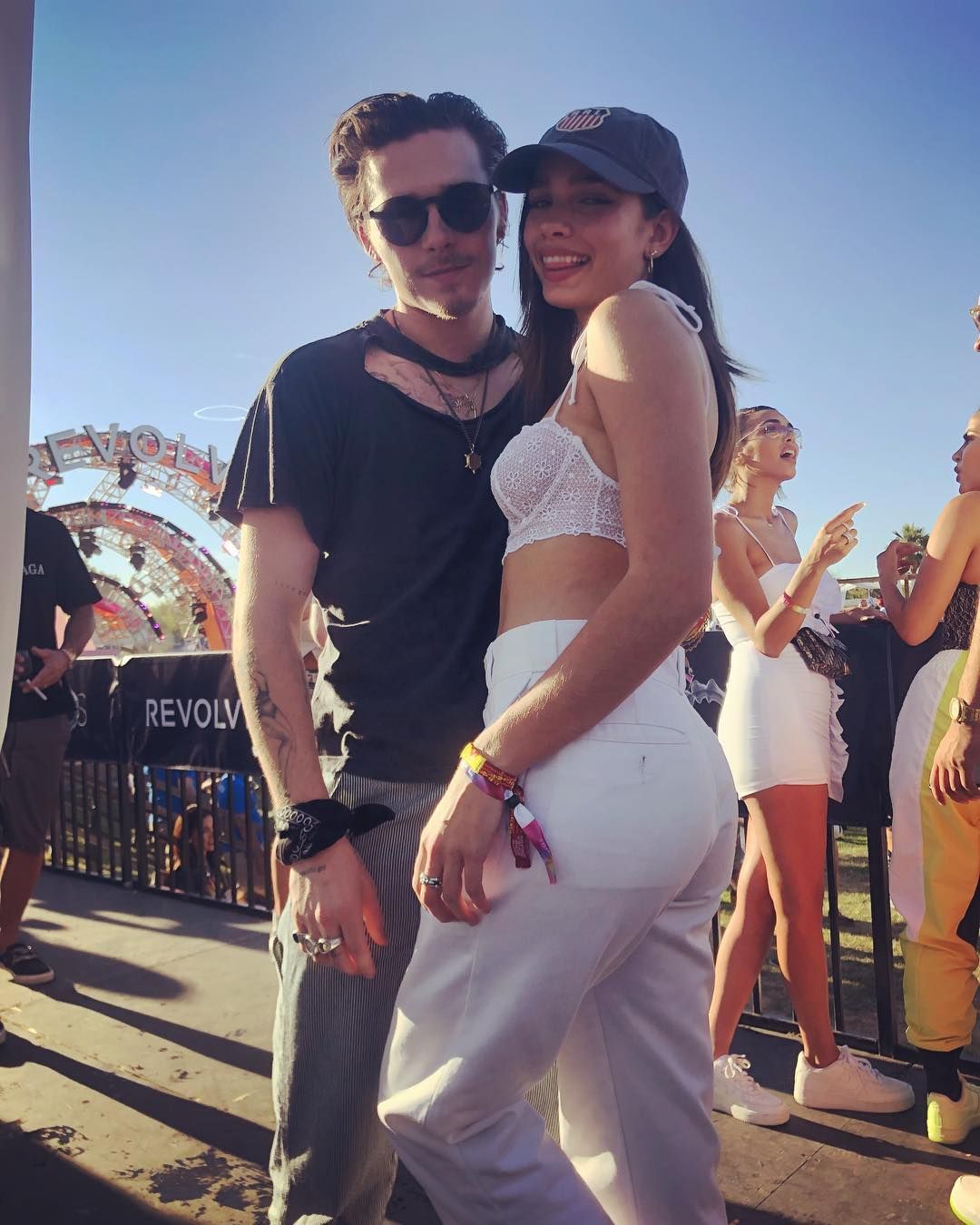 Image may contain: Brooklyn Beckham and Hana Cross, Brooklyn Beckham, Hana Cross, relationship, together, split, breakup, reason, argument, timeline, dating, drama, Instagram, Amusement Park, Theme Park, Evening Dress, Fashion, Gown, Robe, Accessories, Sunglasses, Accessory, Clothing, Apparel, Shoe, Footwear, Person, Human