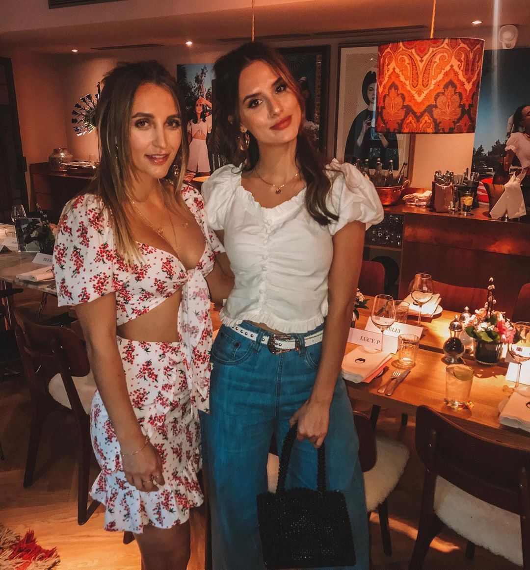Image may contain: Made in Chelsea heirs, Made in Chelsea, MIC, family, fortunes, money, business, company, worth, cash, inheritance, Tiffany Watson, Lucy Watson, Greene King, pubs, Dining Room, Gown, Fashion, Evening Dress, Robe, Room, Indoors, Chair, Apparel, Clothing, Table, Dining Table, Restaurant, Furniture, Pub, Bar Counter, Person, Human