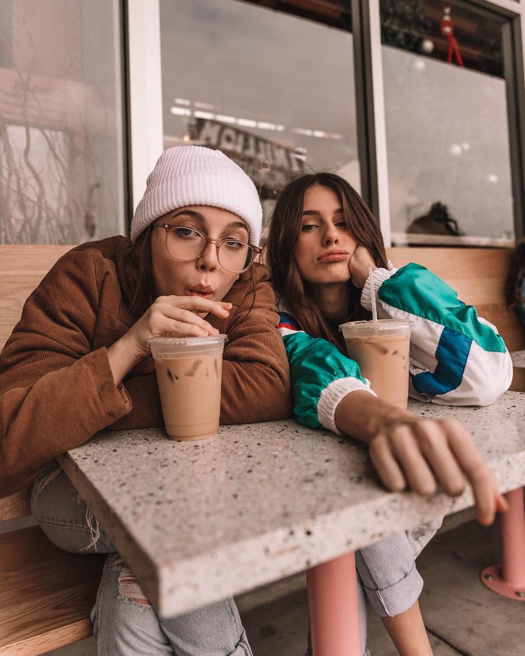 Image may contain: VSCO girl meaning, VSCO girl, tumblr, Emma Chamberlain, explained, what, how to become, step by step, jokes, sayings, sksksk, meaning, and I oop, hairstyles, bag, scrunchie, hydro flask, straw, Female, Footwear, Shoe, Cup, Coffee Cup, Finger, Wood, Cafe, Restaurant, Apparel, Clothing, Sitting, Person, Human