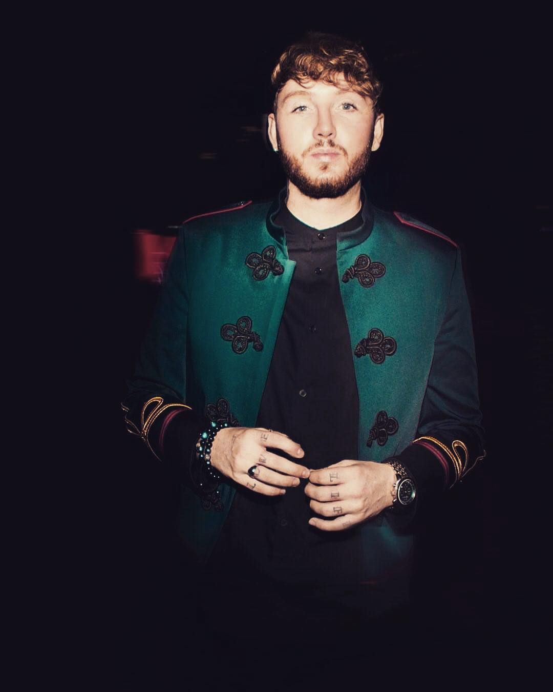 Image may contain: reality TV rich list, UK, reality TV, net worth, earnings, money, salary, rich, worth, James Arthur X Factor, Finger, Man, Overcoat, Coat, Clothing, Apparel, Human, Person