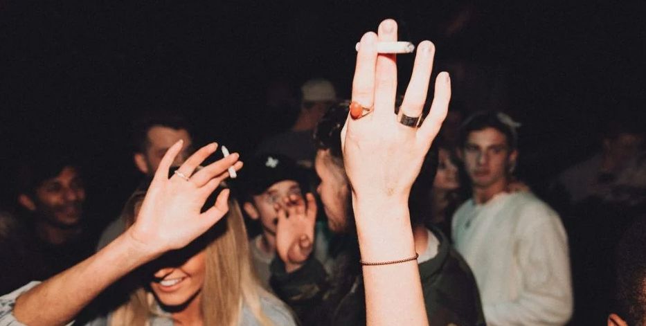 Image may contain: Finger, Night Life, Hand, Face, Night Club, Audience, Crowd, Club, Party, Human, Person