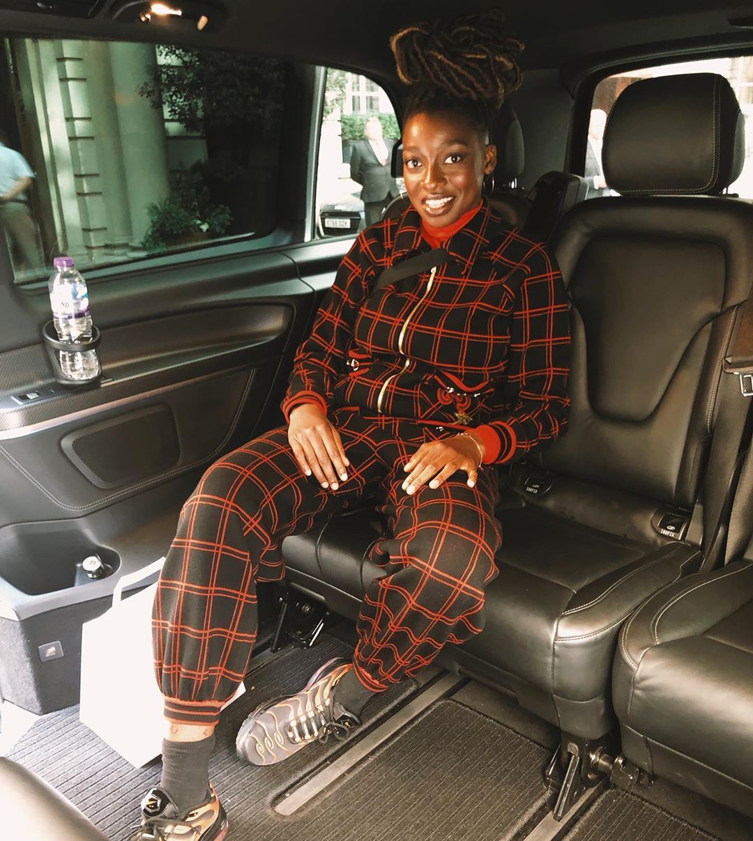 Image may contain: Top Boy cast, Top Boy, season 3, Netflix, Simbi, Lisa Dwan, Lizzie, Little Simz, Shelley, Footwear, Shoe, Apparel, Clothing, Sitting, Headrest, Car Seat, Human, Person, Cushion