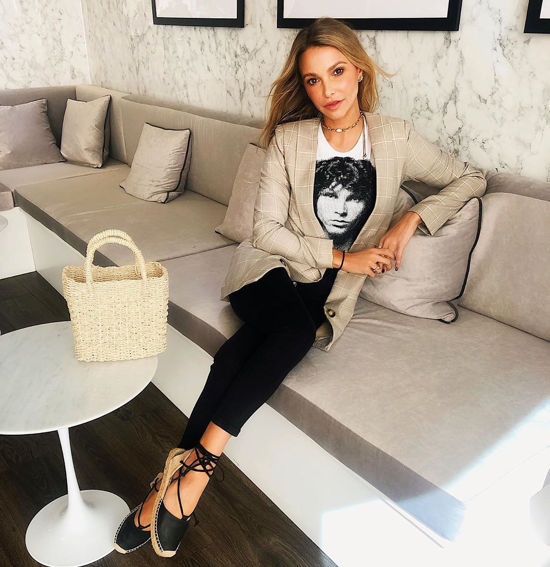 Image may contain: High Heel, Furniture, Couch, Shoe, Footwear, Person, Human, Clothing, Apparel