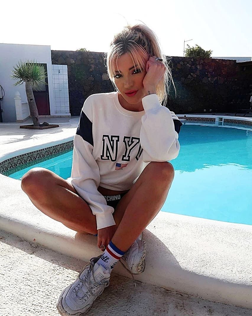 Image may contain: The Circle contestants' Instagrams, The Circle, players, contestants, cast, lineup, Emelle Smith, Instagram, Insta, real life, Hotel, Building, Swimming Pool, Human, Person, Shoe, Apparel, Clothing, Footwear, Water, Pool