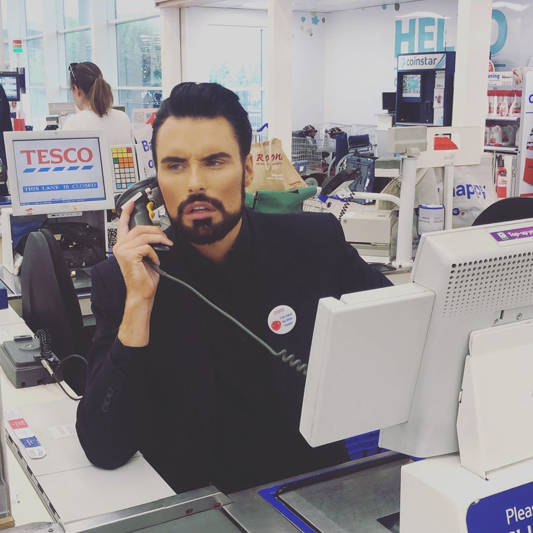 Image may contain: reality TV rich list, UK, reality TV, net worth, earnings, money, salary, rich, worth, Rylan, Indoors, Screen, Monitor, Display, Pc, Electronics, Computer, Human, Person, Desk, Table, Furniture