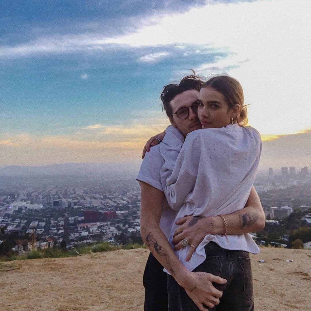 Image may contain: Brooklyn Beckham and Hana Cross, Brooklyn Beckham, Hana Cross, relationship, together, split, breakup, reason, argument, timeline, dating, drama, Instagram, Landscape, Man, Hug, Outdoors, Nature, Pants, Human, Person, Clothing, Apparel