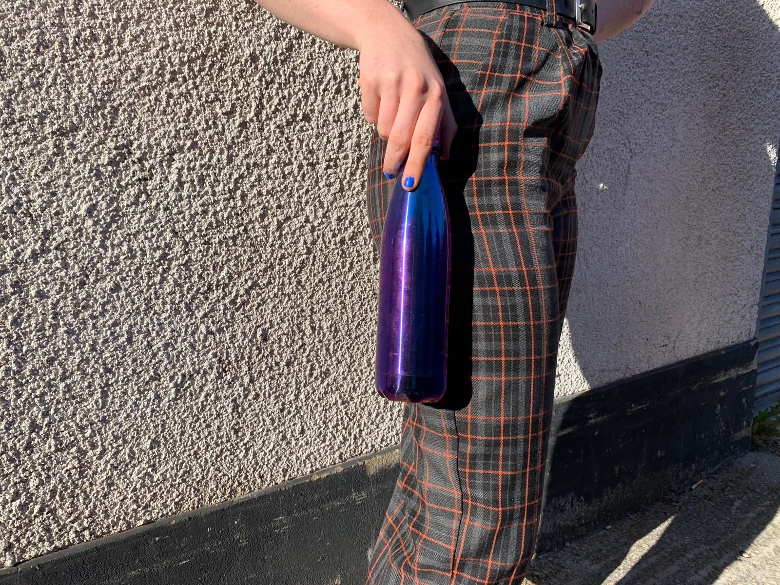 Image may contain: Linen, Undershirt, Shorts, Pants, Footwear, Home Decor, Tartan, Plaid, Human, Person, Apparel, Clothing