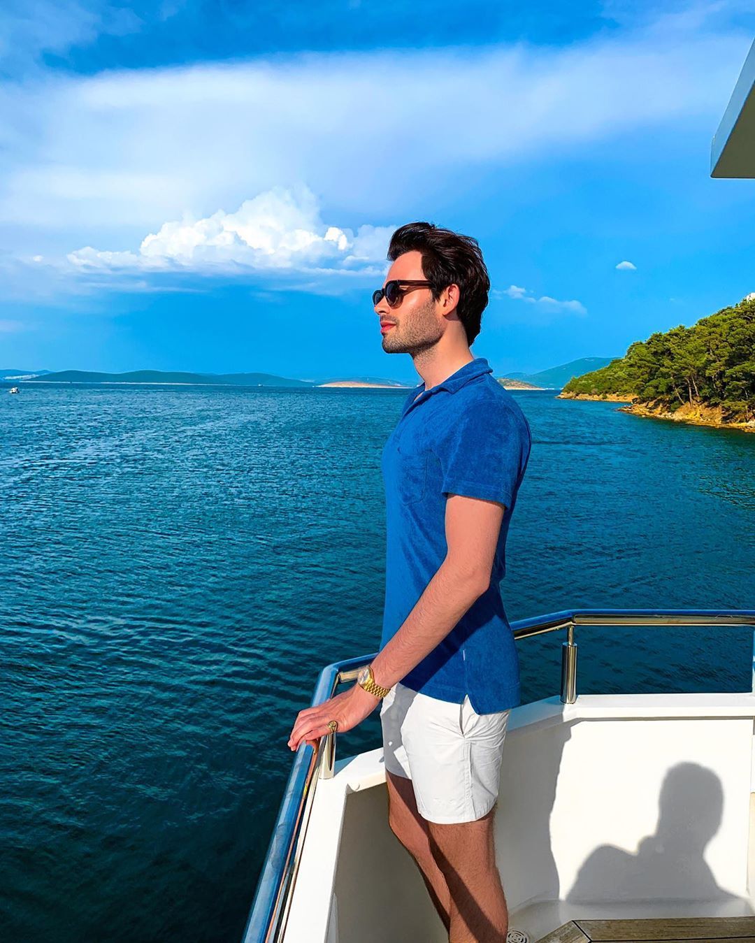 Image may contain: Man, Watercraft, Vessel, Vehicle, Transportation, Nature, Water, Outdoors, Sunglasses, Accessory, Accessories, Human, Person, Clothing, Apparel, Shorts