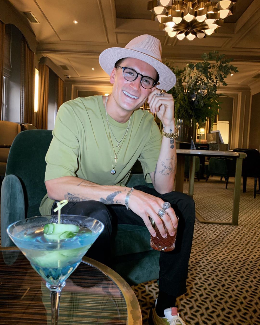 Image may contain: Made in Chelsea fake followers, Made in Chelsea, MIC, cast, Instagram, fake, followers, real, Oliver Proudlock, proudlock, comments, likes, Martini, Footwear, Shoe, Chair, Furniture, Accessories, Glasses, Accessory, Apparel, Clothing, Hat, Human, Person, Drink, Beverage, Cocktail, Alcohol