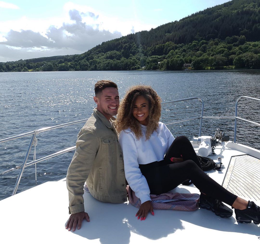 Image may contain: Amber and Greg split, Amber Gill, Greg OShea, Love Island, split, break up, text, reason, Shoe, Footwear, Sleeve, Sitting, Human, Person, Apparel, Clothing
