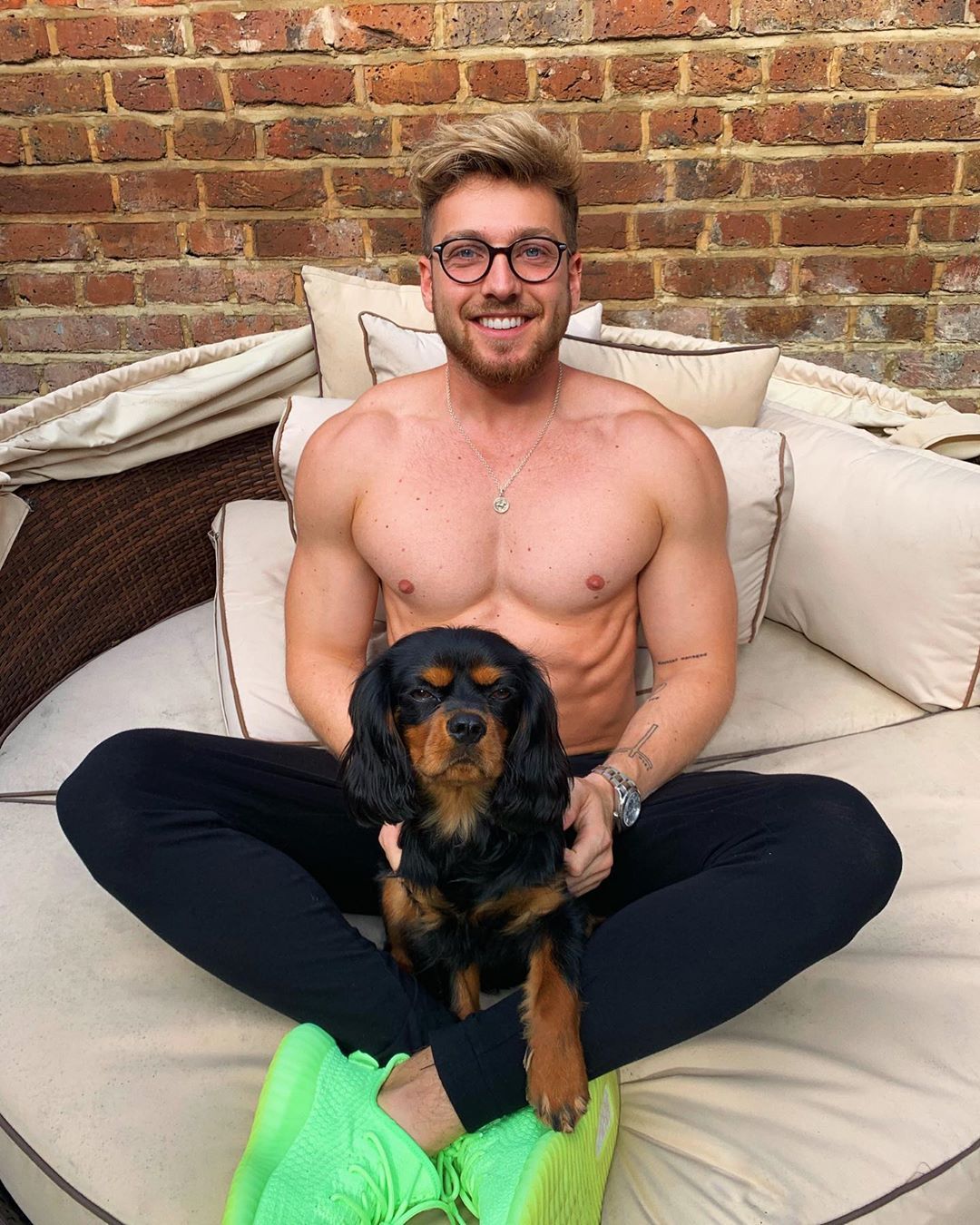Image may contain: Made in Chelsea fake followers, Made in Chelsea, MIC, cast, Instagram, fake, followers, real, Sam Thompson, comments, likes, Sitting, Cushion, Pet, Mammal, Animal, Canine, Person, Human, Couch, Furniture