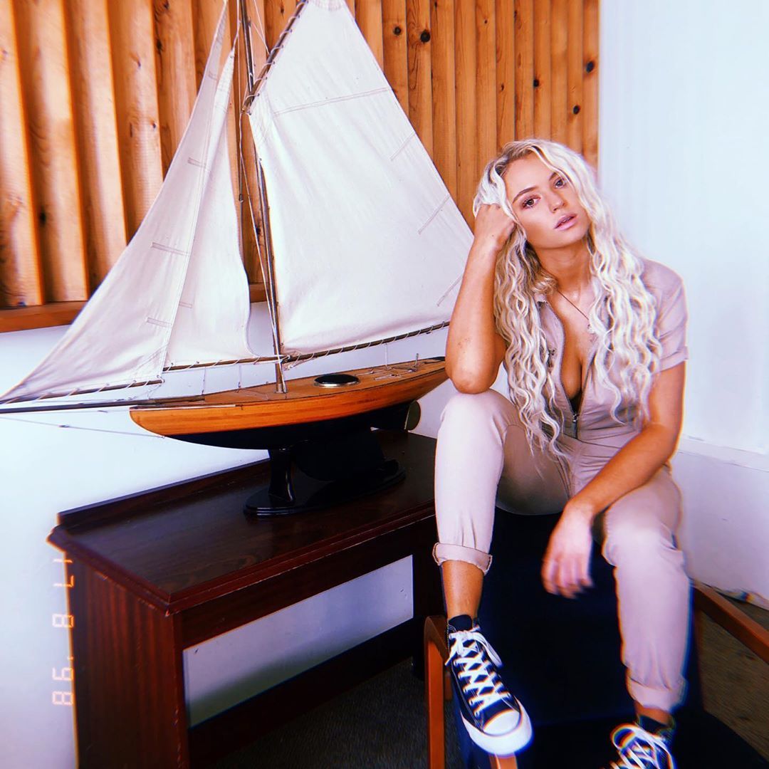 Image may contain:  Love Island 2019 contestants, Love Island, 2019, now, job, Instagram, updates, news, latest, series five, Lucie Donlan, Tent, Plywood, Running Shoe, Shelf, Furniture, Hardwood, Person, Human, Wood, Footwear, Shoe, Clothing, Apparel