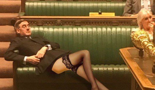 Image may contain: Jacob Rees-Mogg memes, Jacob Rees-Mogg, meme, slouch, asleep, Parliament, Brexit, House of Commons, debate, slump, Thigh, Room, Skin, Apparel, Clothing, Chair, Couch, Furniture, Interior Design, Indoors, Person, Human