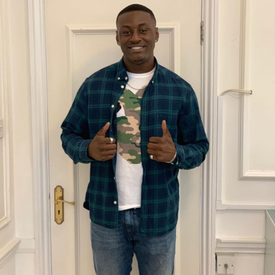 Image may contain:  Love Island 2019 contestants, Love Island, 2019, now, job, Instagram, updates, news, latest, series five, Sherif Lanre, Wood, Man, Home Decor, Door, Pants, Human, Person, Apparel, Clothing