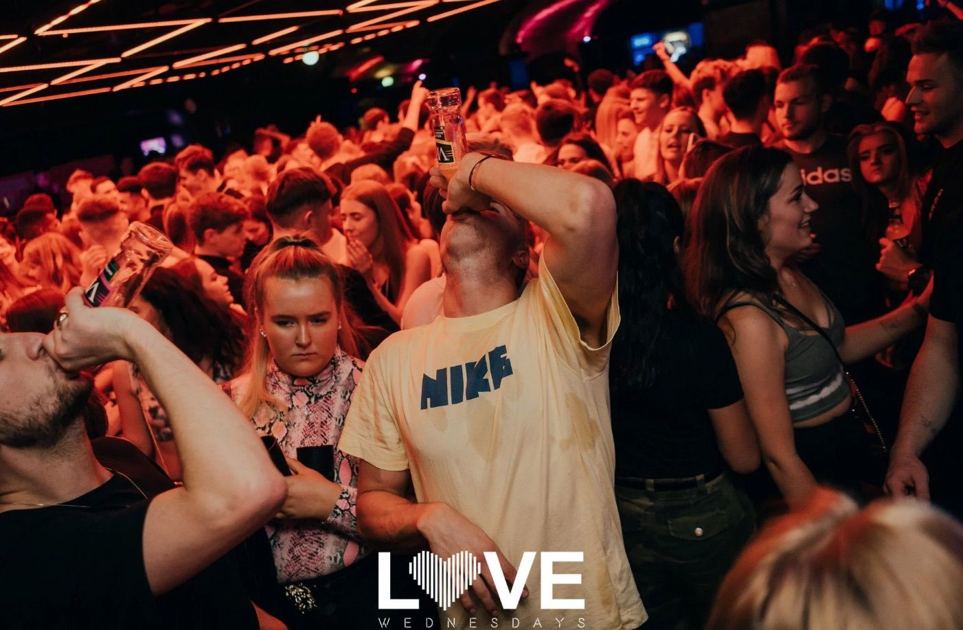 Image may contain: Skin, Night Club, Interior Design, Indoors, Club, Party, Night Life, Person, Crowd, Human, Audience