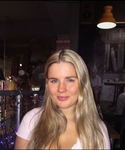 Image may contain: Bar Counter, Pub, Apparel, Clothing, Smile, Face, Person, Human, Girl, Woman, Female, Teen, Blonde, Child, Kid