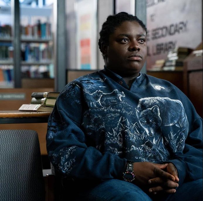 Image may contain: Library, Book, Shelf, Room, Indoors, Furniture, Sitting, Person, Human, sex education season two new cast, netflix, chinenye ezeudu, netflix, viv
