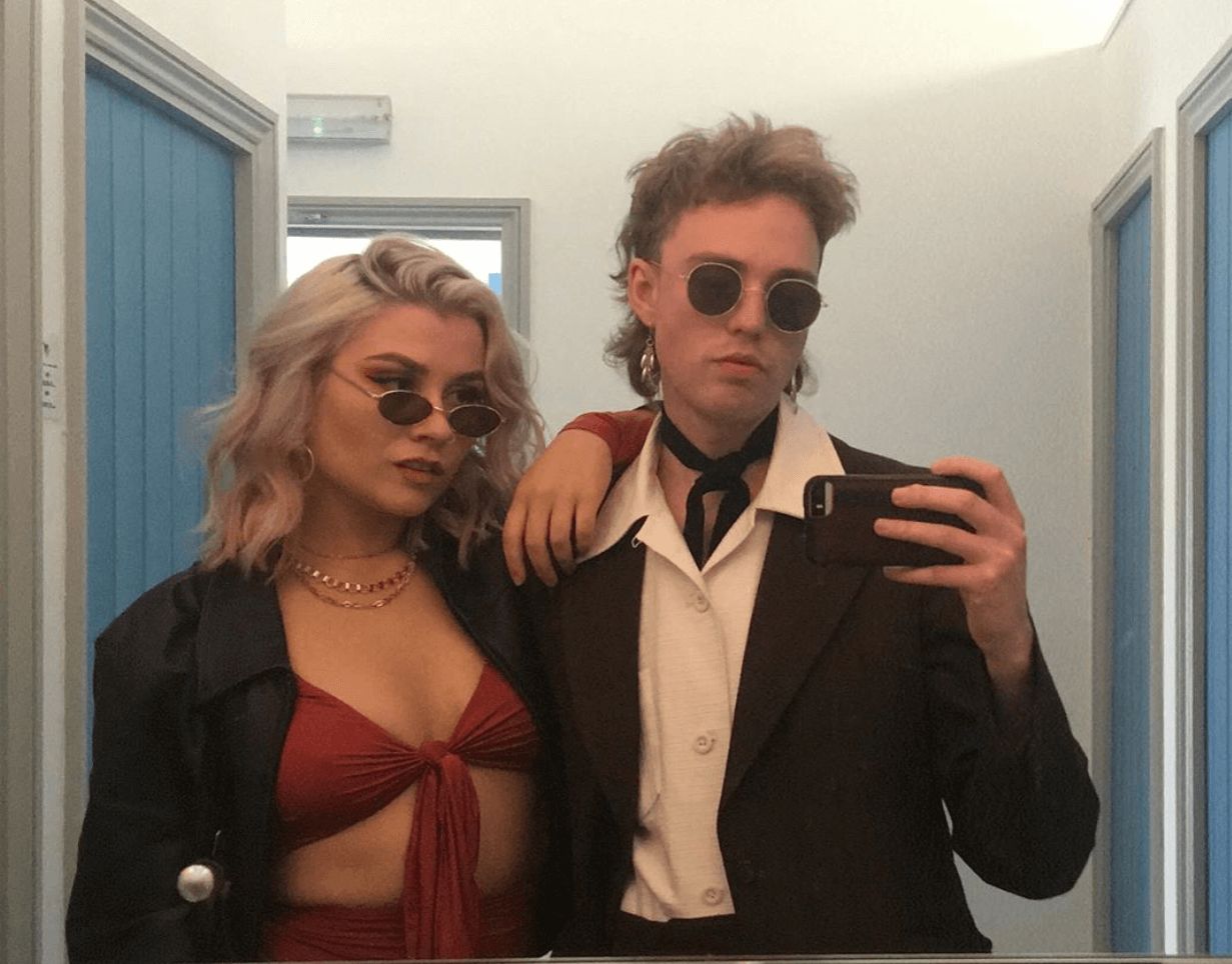 Image may contain: Premiere, Blazer, Jacket, Fashion, Suit, Overcoat, Coat, Apparel, Clothing, Accessories, Sunglasses, Accessory, Person, Human