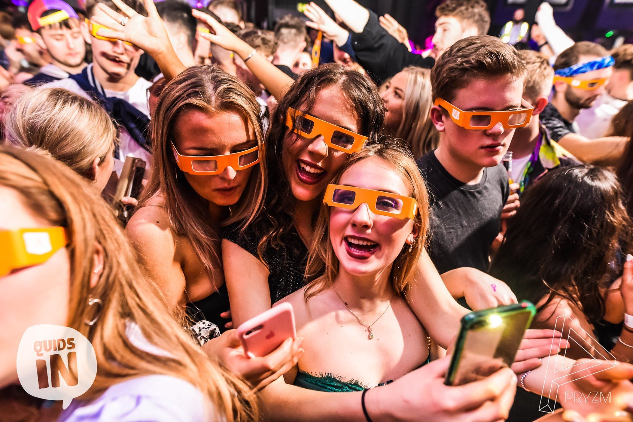 Image may contain: Vacation, Tourist, Crowd, Mobile Phone, Cell Phone, Apparel, Helmet, Clothing, Night Life, Electronics, Phone, Human, Person, Accessory, Accessories, Sunglasses
