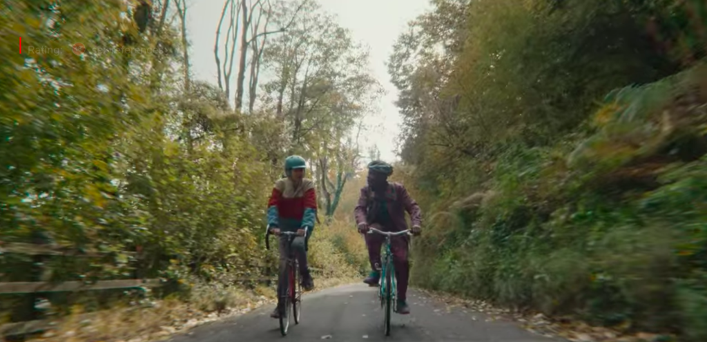 Otis and Eric bike ride to school across River Wye in Sex Education