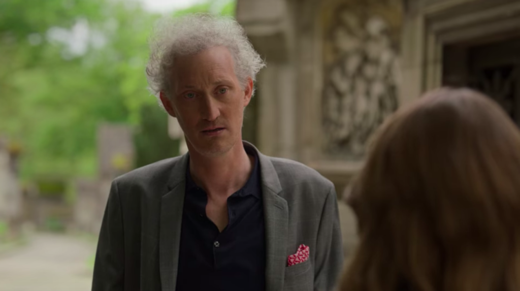 The YOU Easter Egg in Luc conversation in season two of Emily in Paris on Netflix
