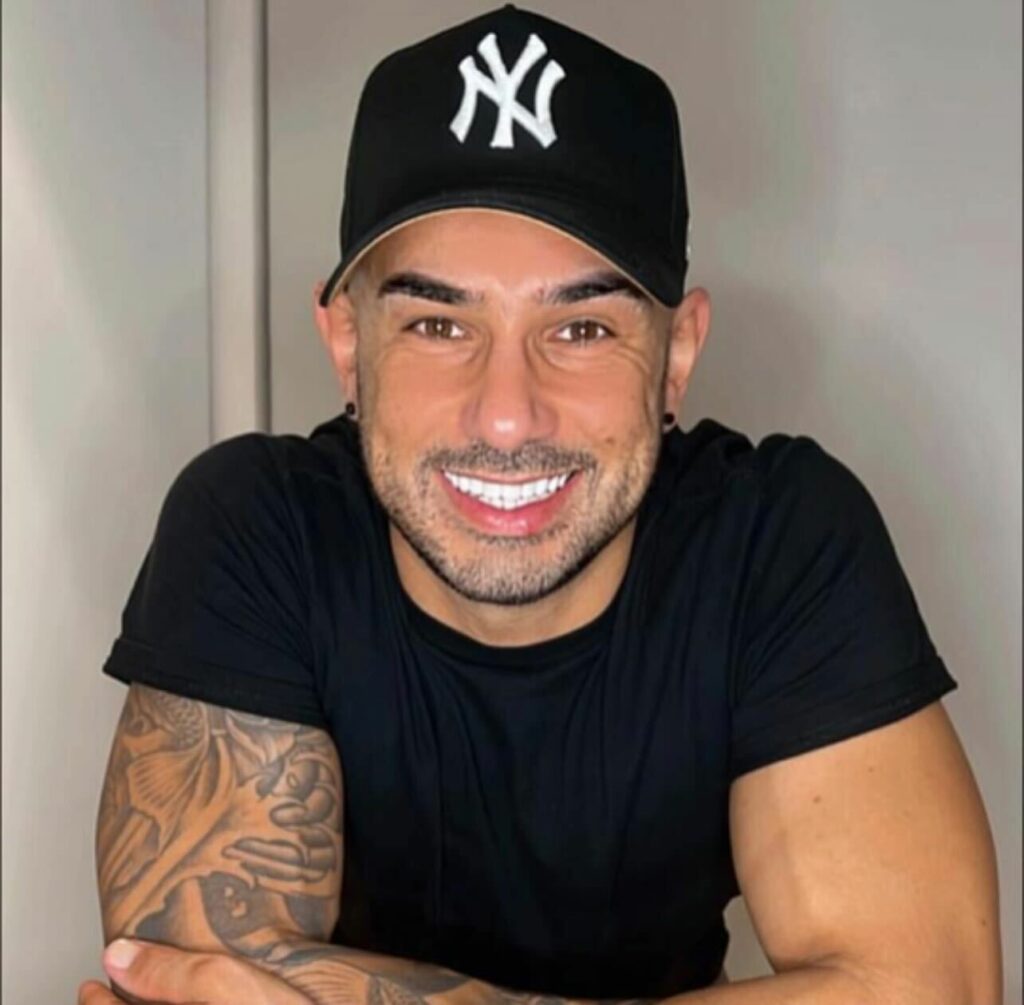 A picture of upcoming MAFS Australia 2024 cast member Simon Flocco smiling with a black cap on