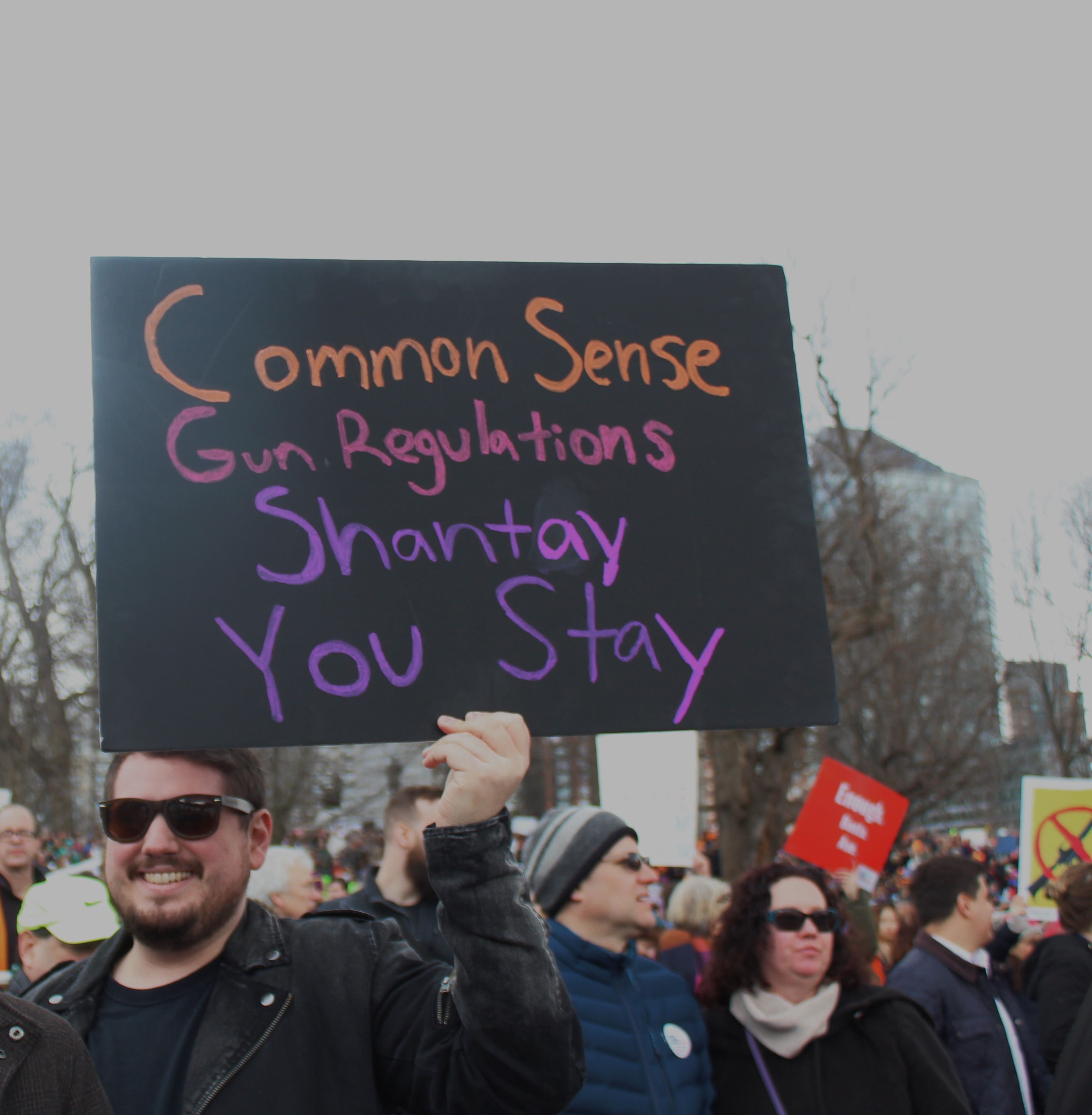 Image may contain: Parade, Text, Banner, Crowd, Person, People, Human